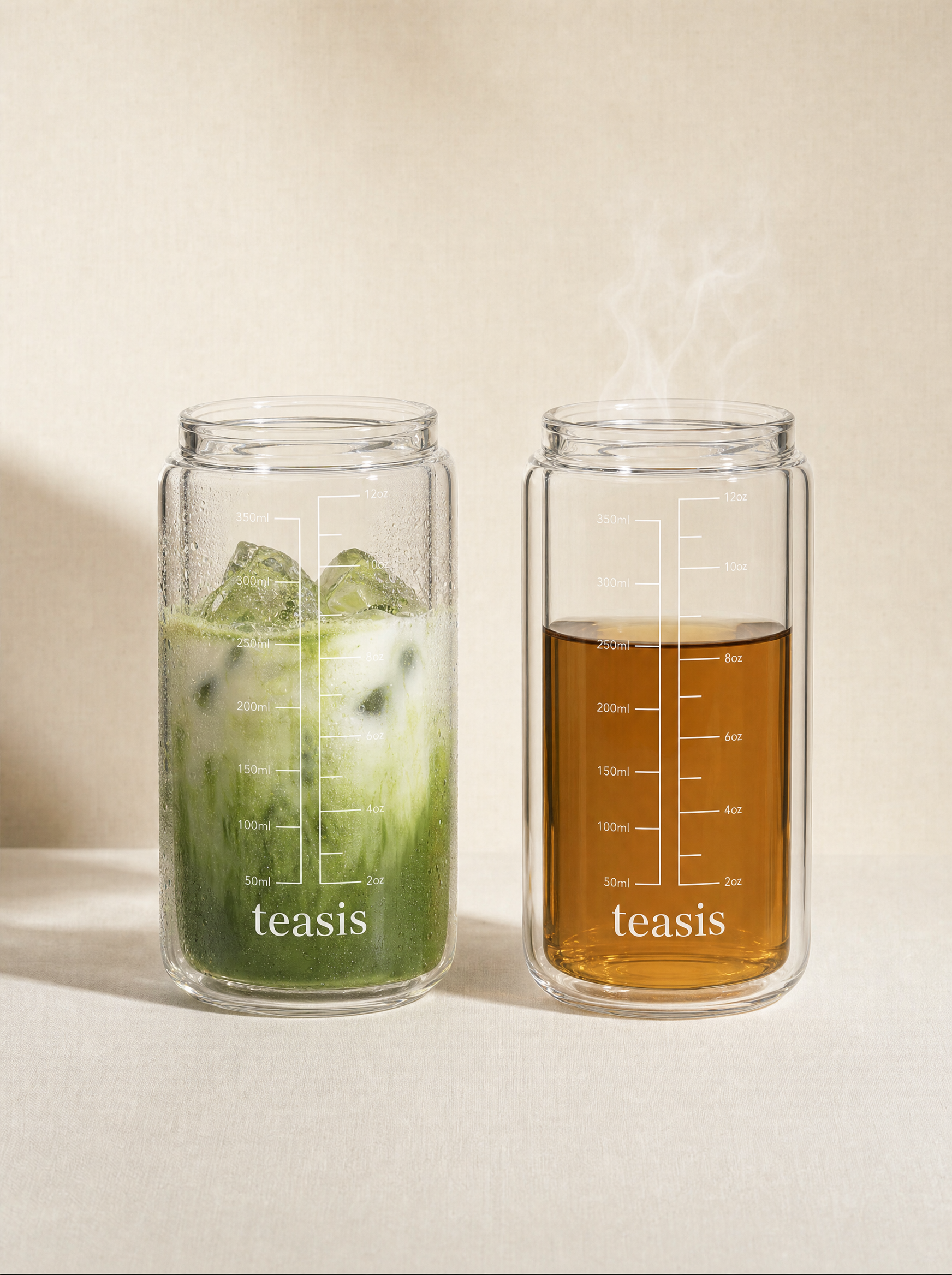兩個 Teasis 儀式杯並排 — 一杯凍抹茶拿鐵有水珠，一杯熱焎茶冒住蒸氣